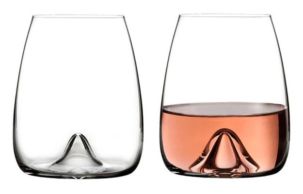 A set of handmade crystal Waterford glasses designed in a sleek and curved silhouette to bring out the flavor and aroma of your favorite wine.