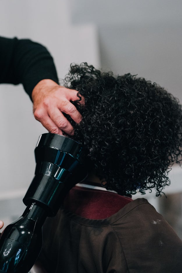 Air drying's cool, but it takes forever. Using a blow dryer with a diffuser attachment minimizes frizz and helps to maintain volume, giving curls an air-dried look in a fraction of the time.