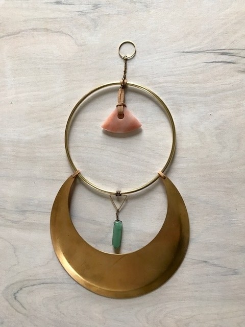 A handmade brass moons mobile with energy healing properties that'll make your 2018 a little less stressful.