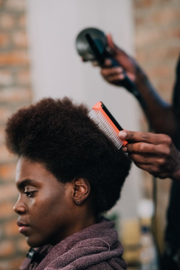 If you're planning to trim or cut coily, shrinkage-prone hair, make sure it's blown out beforehand to ensure manageability.