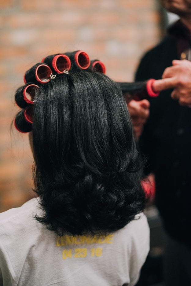 After all of the hair was curled and set, Andre carefully removed each roller, applied a bit of Q-oil, and vigorously brushed it through Natelege's tresses.