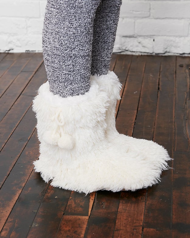 A pair of fluffy pom slippers that'll make you feel like a yeti from the ankle down.