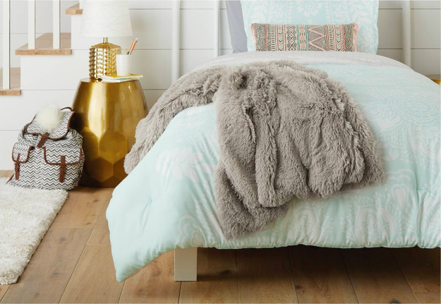 A faux fur throw blanket that will make you feel like you're wrapped in a cloud.