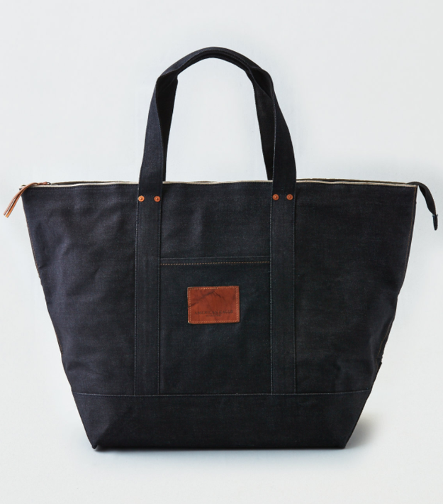 A durable denim tote you can stuff your whole life into. Phones, wallets, headphones, receipts, gum wrappers, etc.