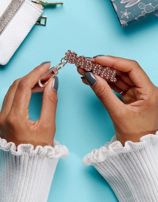 A glitzy keychain you can couple with a nice note or something about how they're as bad as Riri.