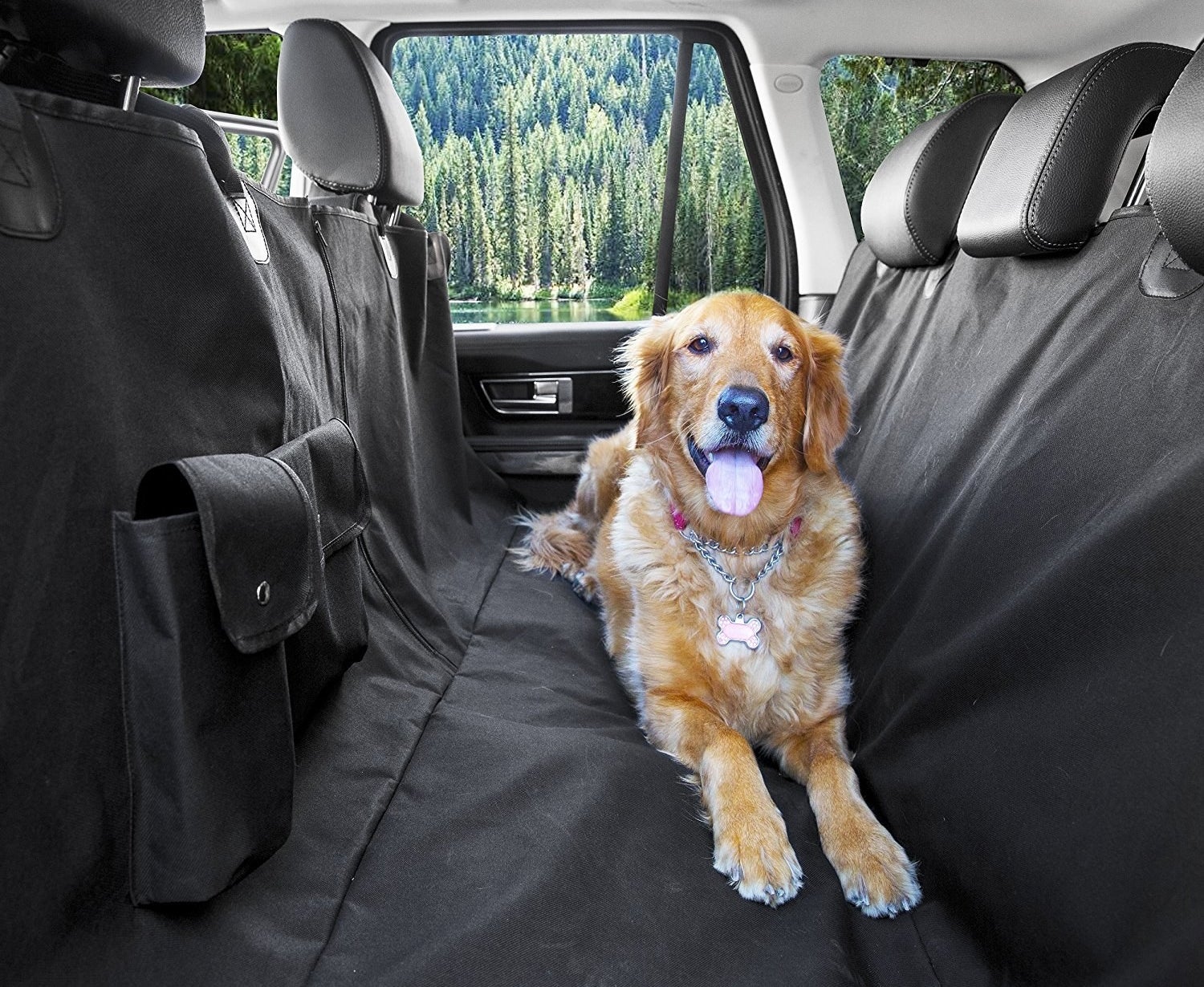 golden retriever sitting on black carseat cover