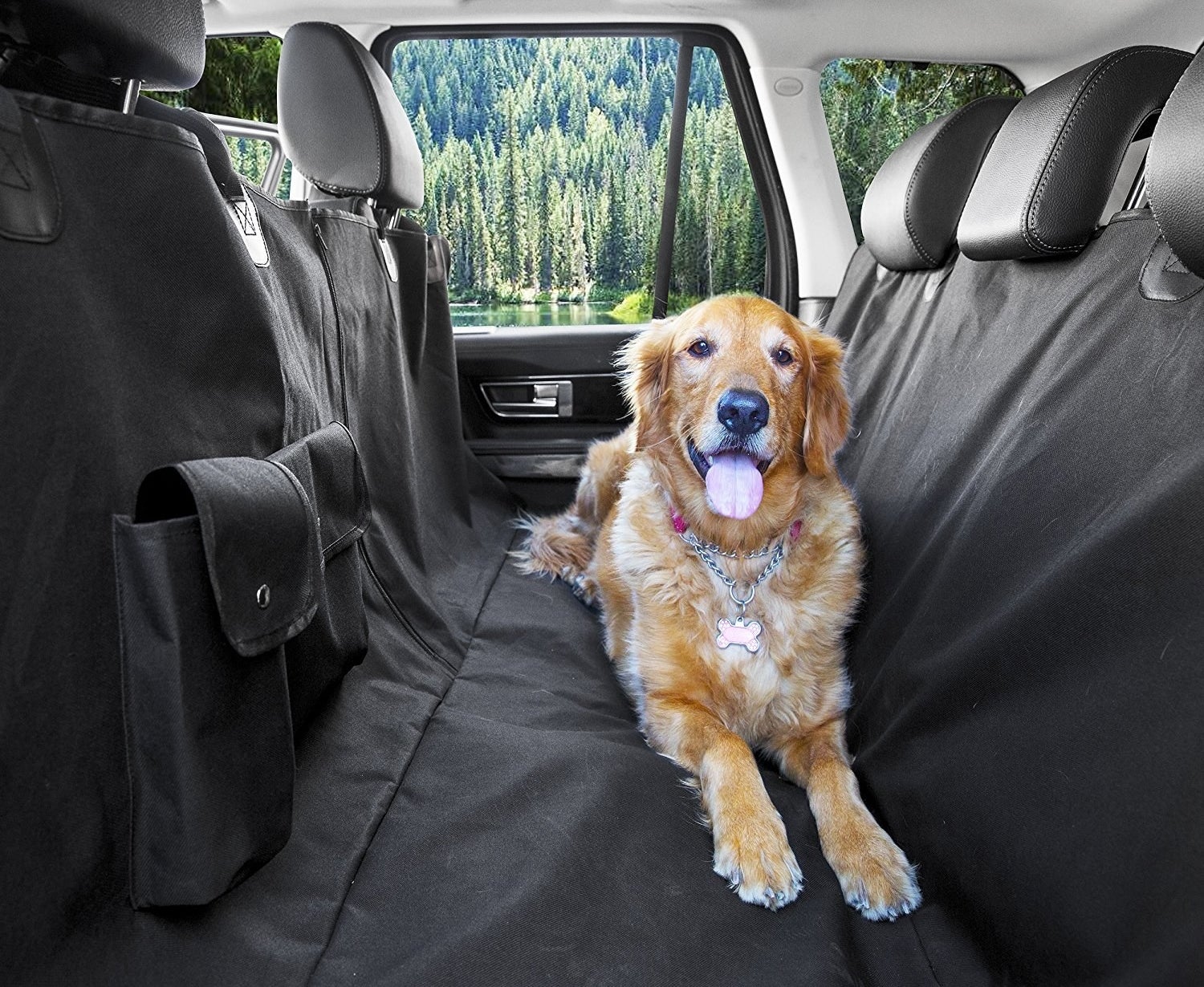 golden retriever sitting on black carseat cover