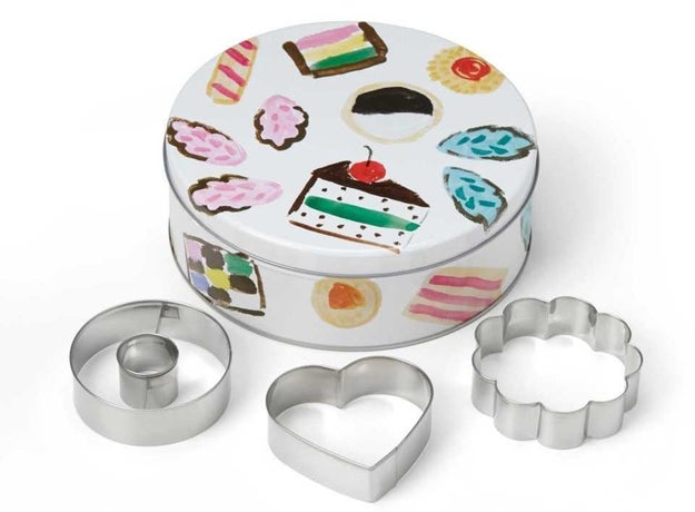 A pretty tin filled with cookie cutters perfect to give to someone who loves baking.