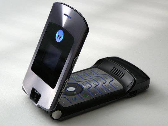 Photo of a half way opened dark grey Motorola Razr. 
