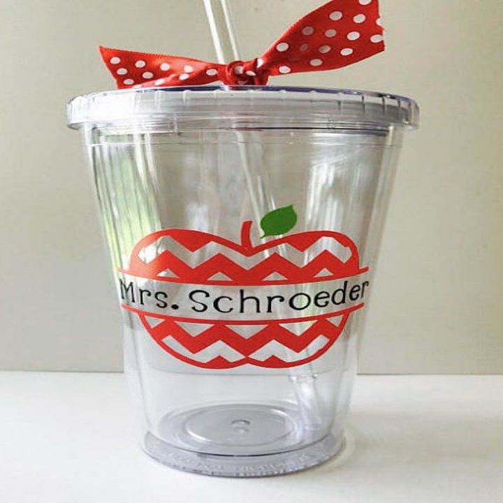 Clear reusable coffee tumbler from Etsy with reusable straw decorated with chevron apple that says "Mrs. Schroeder" 