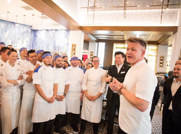 Here he is again, with dozens of employees he recruited with a single 