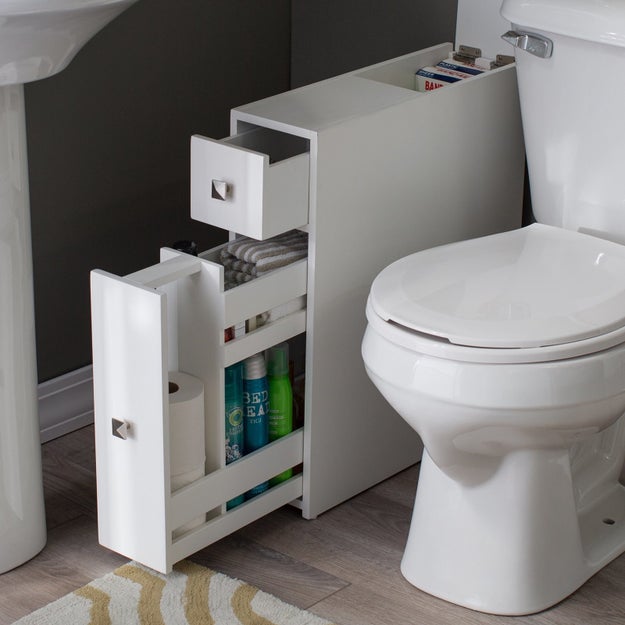 Provide yourself with some enclosed storage space thanks to a narrow cabinet that'll fit in the awkward space between the toilet and the sink.