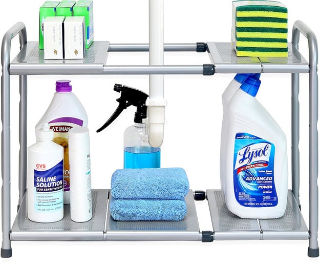 Organize your bathroom cleaning supplies with an expandable under-sink rack. You can adjust the height of the shelves, too!