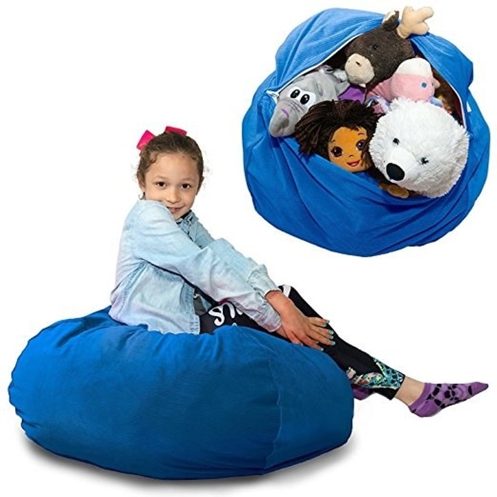 blue beanbag filled with stuffed animals and then a kid sitting on it