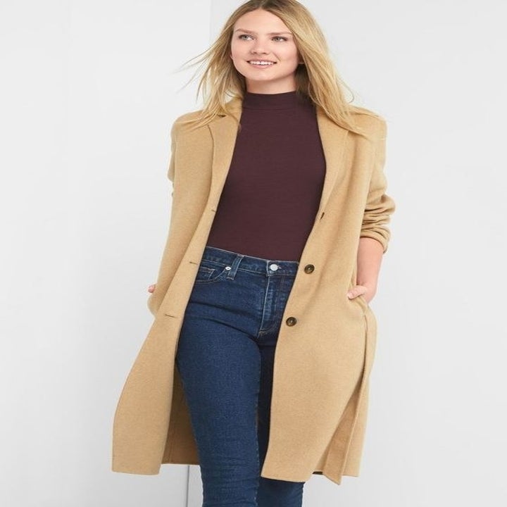 model wearing a taupe wool coat