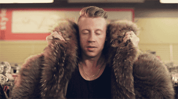 gif of Macklemore in &quot;Thrift Shop&quot; music video
