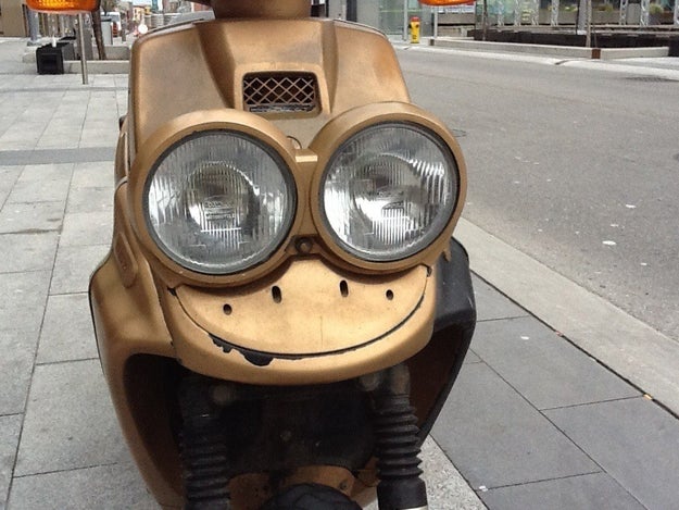 This happy dude is glad to be part of a scooter.