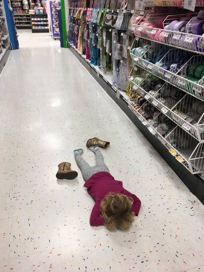 child throwing tantrum on floor