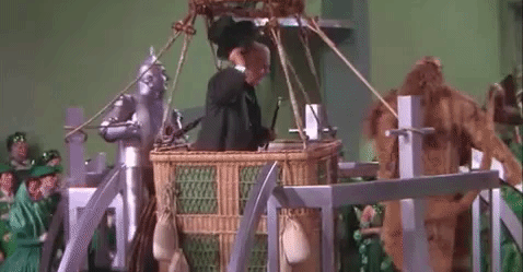 In The Wizard of Oz, Dorothy is about to leave with The Wizard, but Toto runs off. She chases him and asks for The Wizard to stay, but you can see the Tin Man untie his balloon and then act surprised when it starts to fly away.