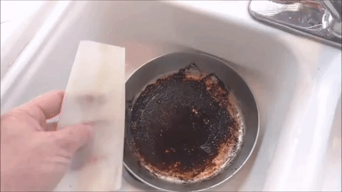 Well, according to this video, first you fill the pan with hot water, dish soap, and the dryer sheet — and let it soak for a bit. Then the grime will lift right off.