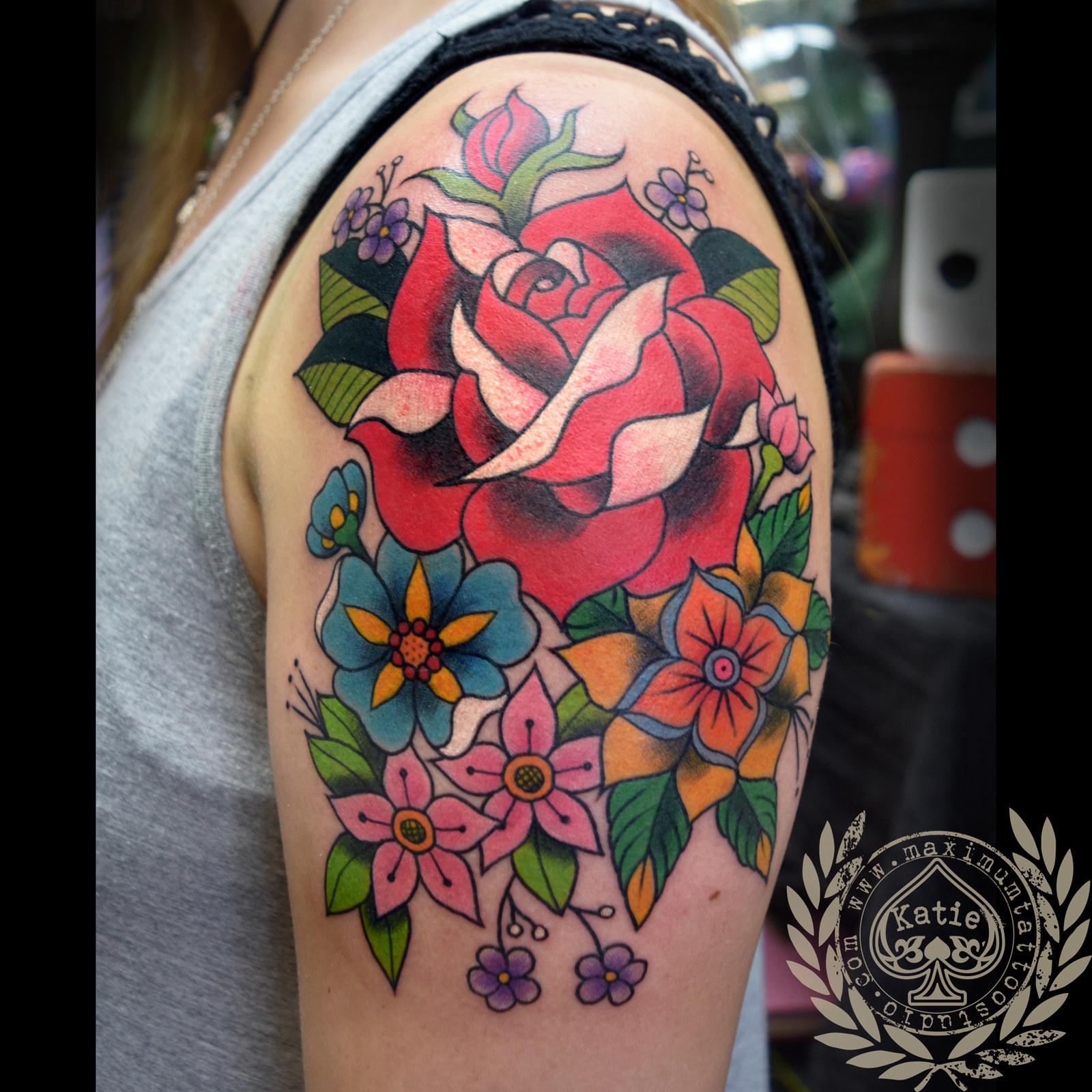 Floral bouquet tattoo by Lindsay April inked on the left arm | Bouquet  tattoo, Flower tattoo on ribs, Minimalist tattoo