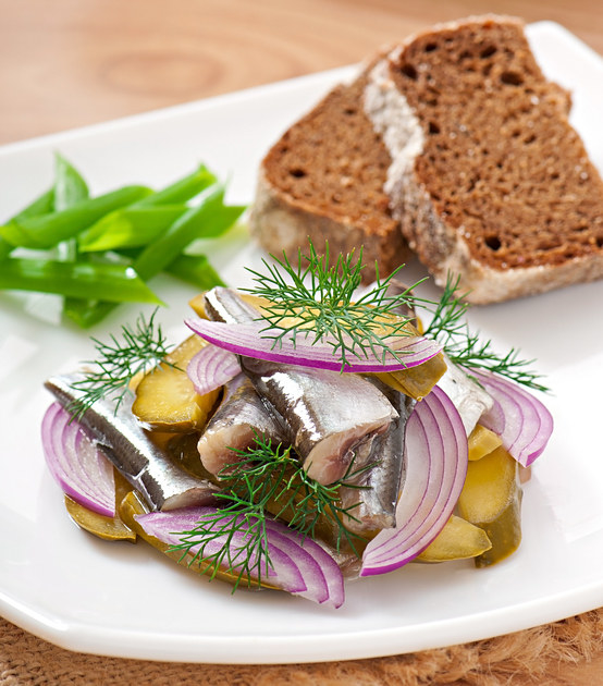 If you're from a Nordic country, is it a herring salad with sliced onions and pickled cucumbers?