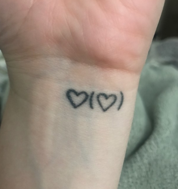 heart with heart in parentheses tattoo