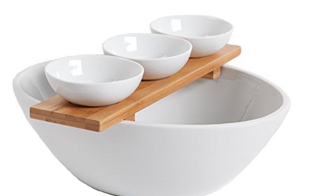 A trendy three-piece serving set with bowls and a bamboo tray to show your guests you've got style.