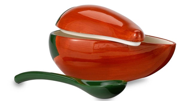 A ceramic salsa bowl and spoon set that can hold almost two whole cups of dip.