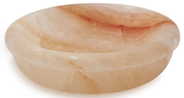 A Himalayan salt bowl that can handle extreme temperatures for a unique way to serve dips.