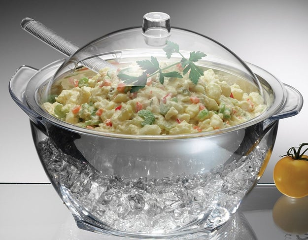 A salad server with an acrylic dome to protect food and keep it cold for hours.