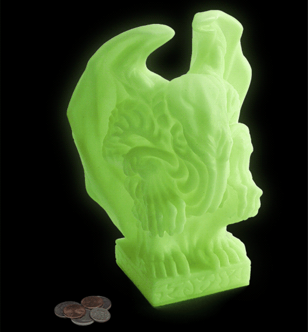 A glowing Cthulhu bank and night light, because nothing says "sweet dreams" like a monstrous embodiment of chaos and death.