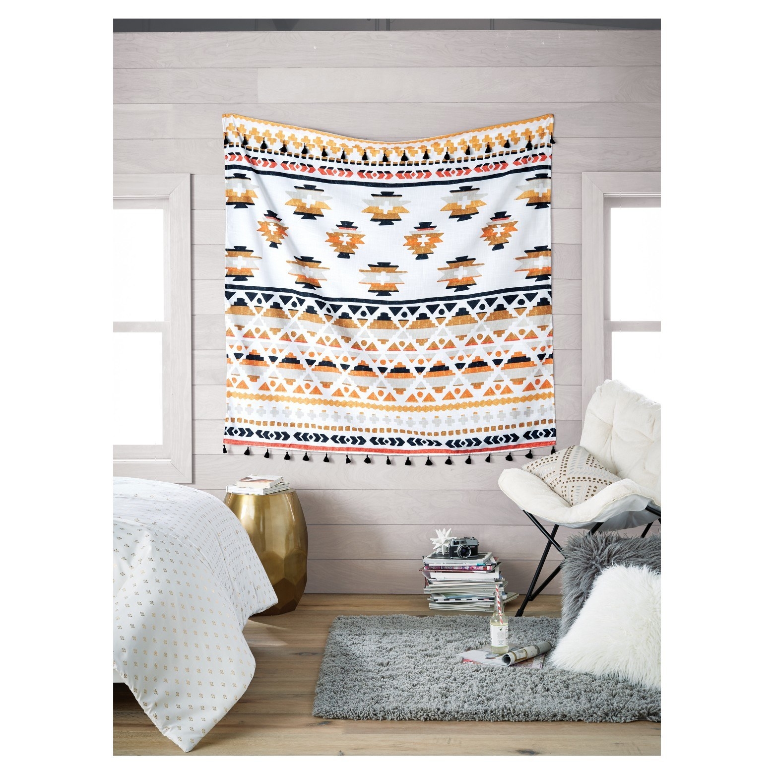 Add another layer of texture with wall tapestries. If you're in an apartment where you can't paint, tapestries are a great way to give your little slice of heaven color and personality. This one is available at Target here.