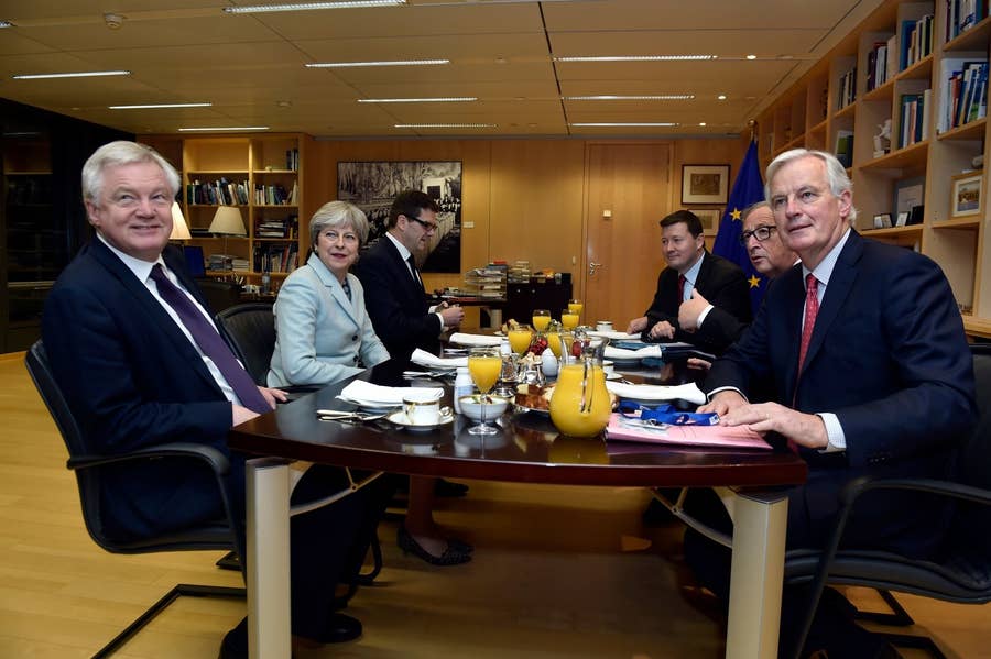 Britain's Secretary of State for Exiting the EU David Davis, Theresa May, European Commission President Jean-Claude Juncker, and EU's chief Brexit negotiator Michel Barnier meet at the European Commission in December 2017 in Brussels.