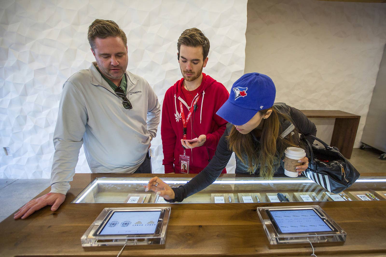 A budtender helps customers select cannabis products at MedMen on Jan. 2.