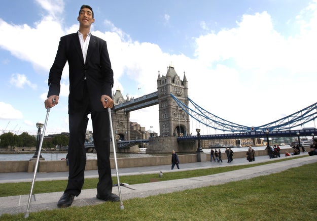 Kosen, a farmer from Turkey, was named the tallest living man in the world by Guinness World Records in February 2011. He also holds the record for the world's largest hands, (11.22 inches from his wrist to the tip of his middle finger).