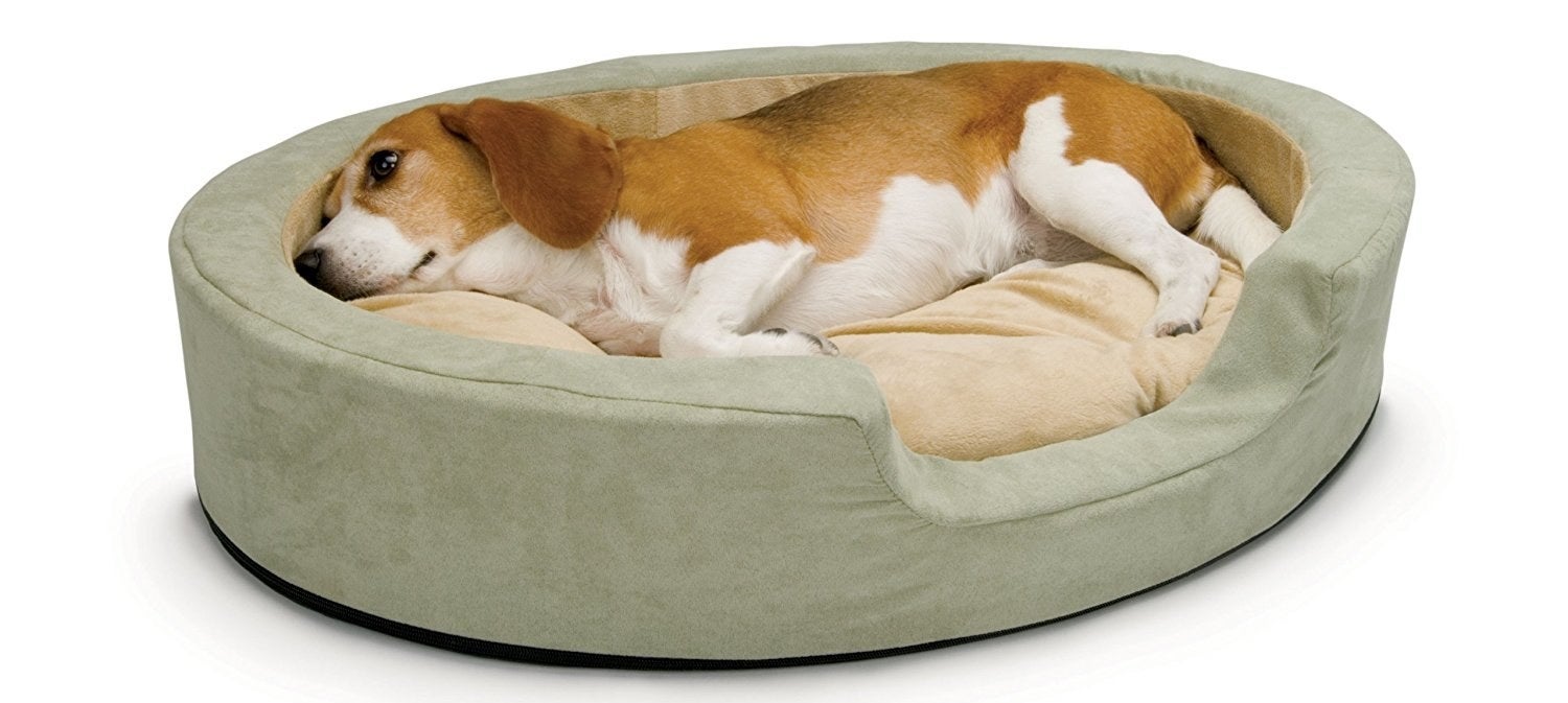 The dual thermostat heater warms to your pet's normal body temperature when in use. The bed remains 10-15 degrees above room temperature when not in use. The cushion and heater are removable so the bed is easy to machine wash. Promising Review: "These beds were a hit right out of the box! I have two Beagles and they love snuggling at night. The problem is that they were taking over my bed and I found my space shrinking more and more every night. So, I began training my dogs to sleep on their own beds but they would refuse. They destroyed so many beds I can't even count them. Then I found these electric beds and voila! My dogs loved them immediately. Just look at the picture! Those are two happy Beagles. Because these beds are warm, my dogs love snuggling in them and it made the transition from my bed to their beds a breeze." —JulianaGet it from Amazon for $63.03 (available in two sizes).