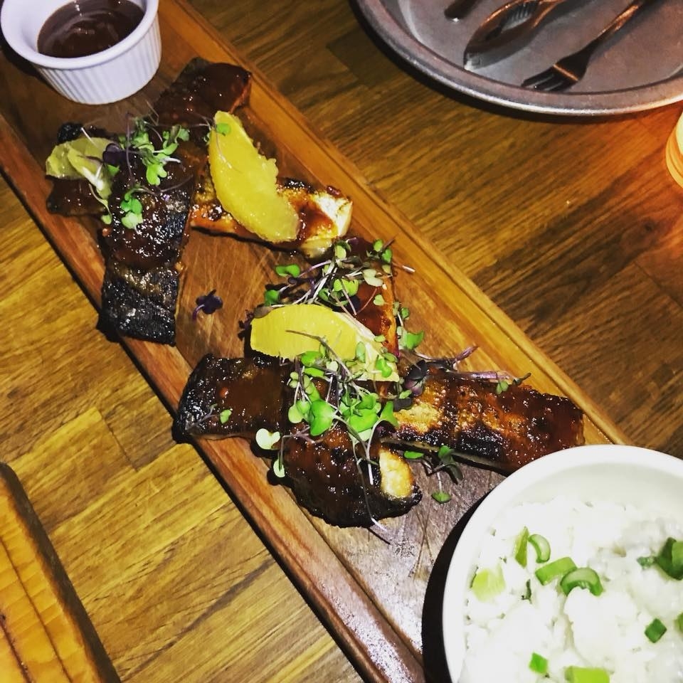 An absolute must, the Barbacoa de Pacu Pacu is a one-of-a-kind dish of grilled Brazilian fish ribs made to look like pork ribs, and rubbed with tangy, addictive house-made orange and chipotle BBQ sauce. The ribs are garnished with a slice of orange and microgreens, and includes a side of extra BBQ sauce and buttery coconut rice. The ribs have amazingly crispy skin with moist, fall-off-the-bones white meat.