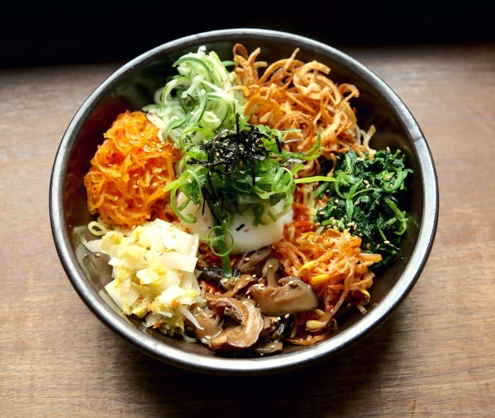 One of the most popular Korean dishes, Bibimbap is a healthy entree with an ensemble of seasonal vegetables, such as bean sprouts, spinach, pickled daikon, shiitake mushroom, daikon kimchi, and cucumber. The dish is served with housemade gochujang dressing. Mix it all together for that irresistible bite!