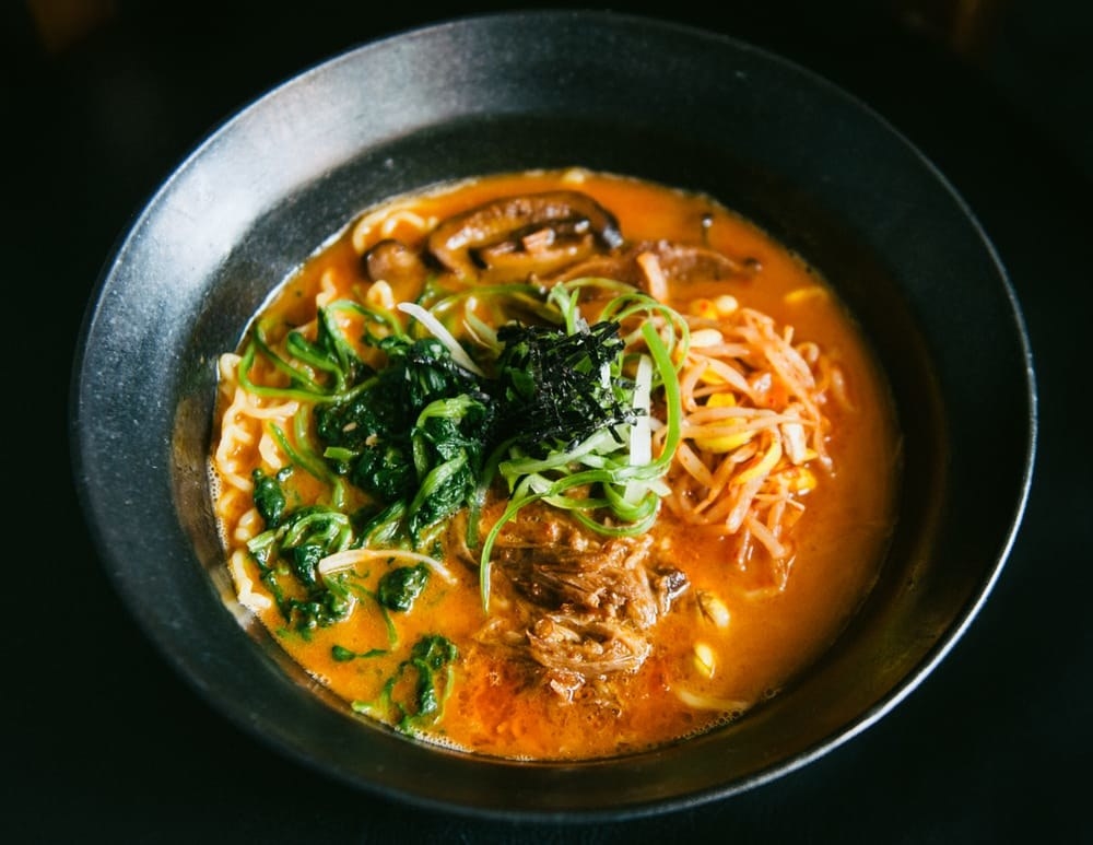 Rich gochujang (spicy chili paste) pork broth is complemented by tender braised pork, spinach, bean sprouts, shiitake mushrooms, scallions, and nori in this wonderfully hearty fan-favorite.