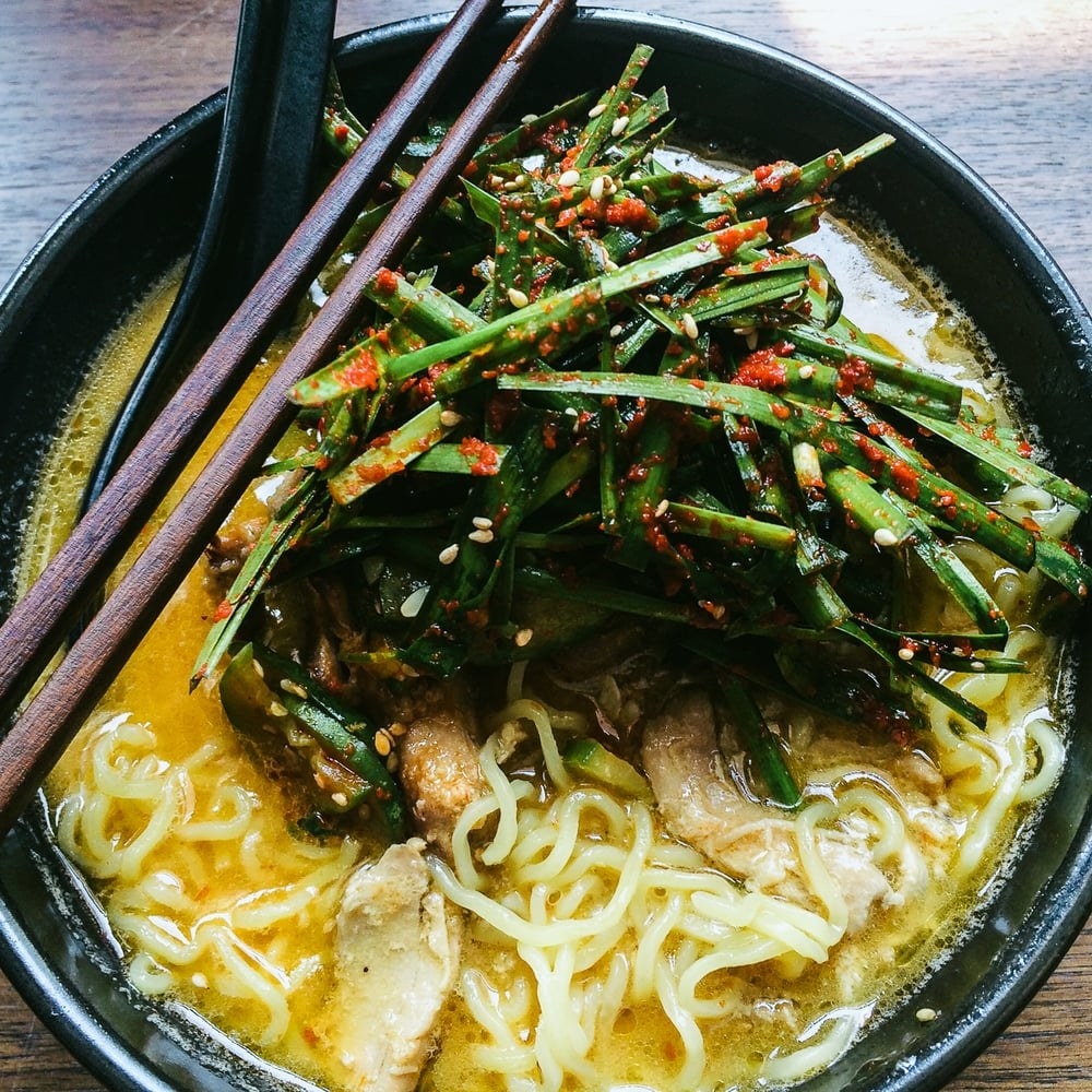 Taste the warm, rich roasted ginger chicken broth paired with moist pulled chicken, cucumber, and garlic chive kimchi for an extra kick. It's like having a satisfying bowl of chicken noodle soup...except much richer and more delicious.