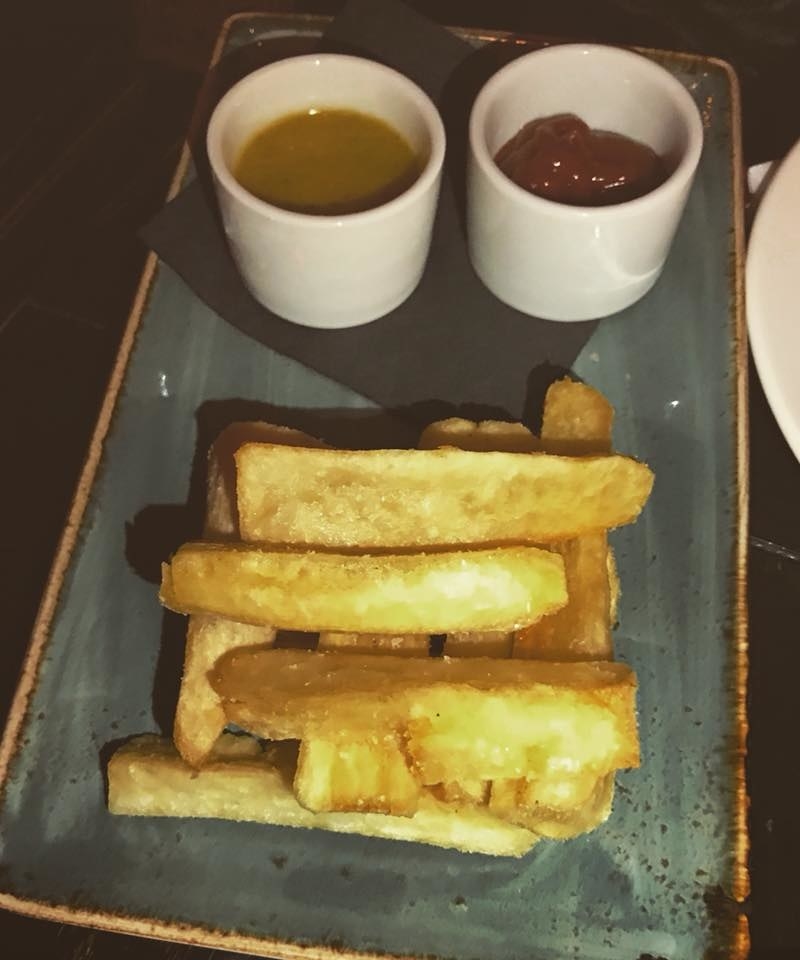 The thick pieces of crispy yucca fries are served with house mojo sauce and gochujang ketchup for those irresistible bites.