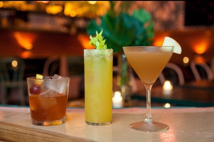 The cocktail menu at The Happiest Hour features unique drinks curated by veteran New York bartender Jim Kearns. Try the signature cocktails like Maid to Order (mint, cucumber and lime juice with your choice of gin, rum, or tequila) and Pineapple Express (pineapple, sage, honey, and lime with Guatemalan rum or tequila), as well as classic cocktails like Lucy and Rickey (Kalamansi, passionfruit, guava, and soda with gin, tequila, or bourbon) or Gibson (gin, blanc vermouth, dry vermouth, house-made pickled onion and brine)