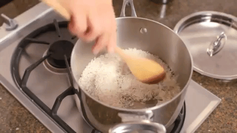 Simply heat a bit of oil in your pot, add the rice, and cook it until the grains of rice become golden and fragrant. Then just add your liquid and cook it like usual. The toasted flavor will be subtle, but it'll be just enough to liven it up a bit. See how to do it here.