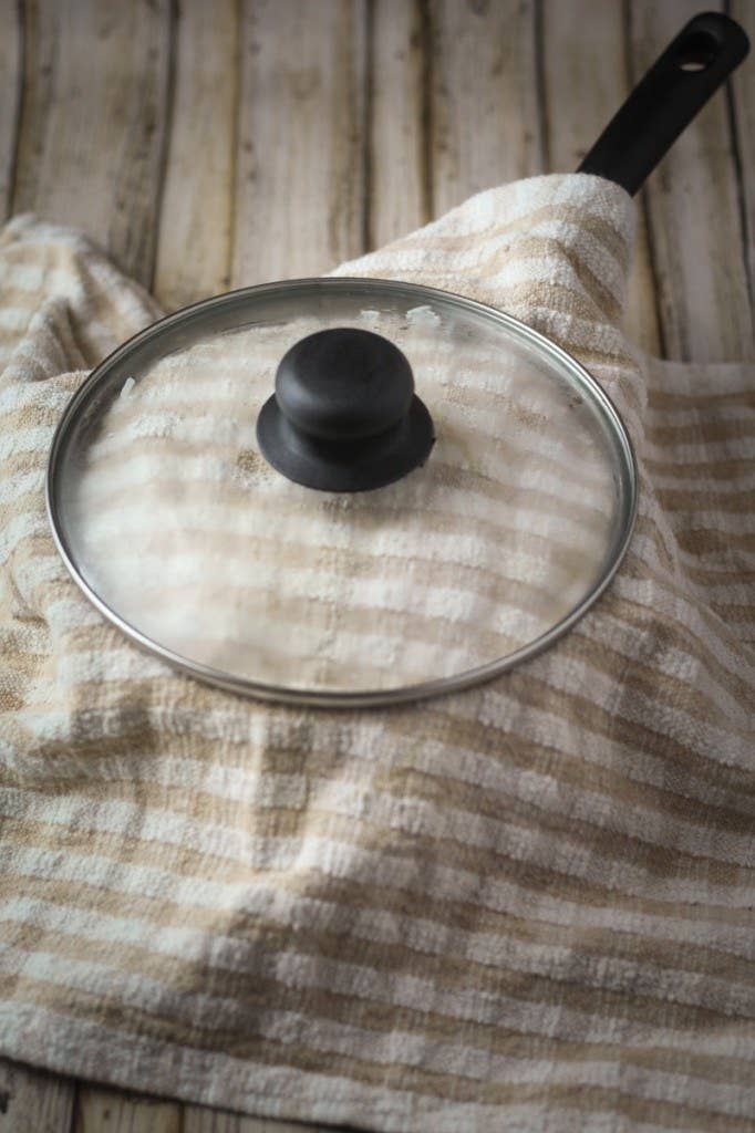 Condensation On Pot Lids Can Be Messy. Fix It With An Easy Towel Trick