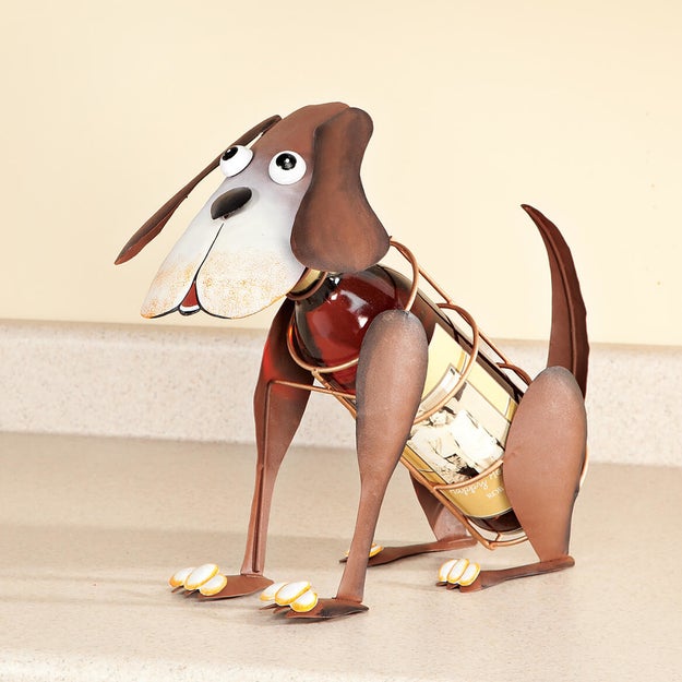 A wine bottle holder with hand-painted details to prove that dogs and wine are really all you ever need.