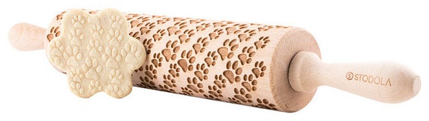 An engraved wooden rolling pin so your cookies can have fun 3D puppy tracks.