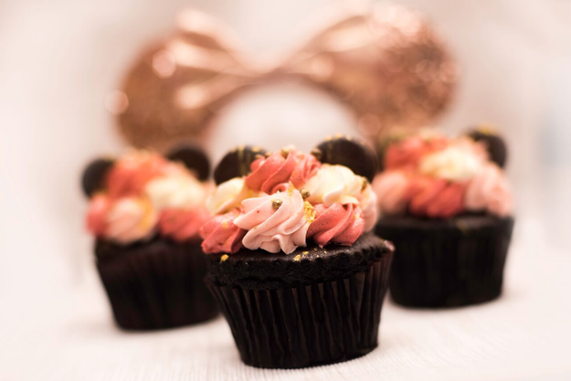 For chocolate fans, this Rose Gold Chocolate Cupcake with strawberry buttercream filling and topping, chocolate ears, and chocolate crispy pearls.
