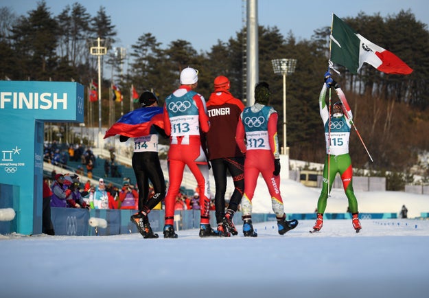 At the finish, his fellow skiers and competitors from Colombia, Tonga, Morocco, and Portugal waited to congratulate him and give him a proper hero's welcome.