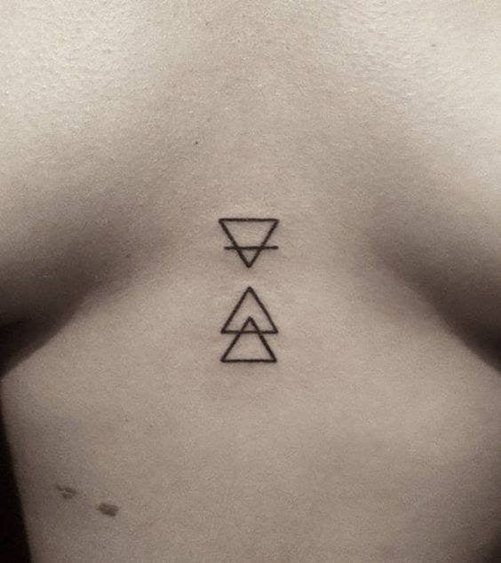 36 Of The Coolest Ideas For Between-The-Boobs Tattoos We've Ever Seen